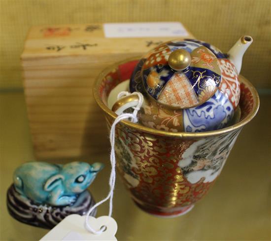 Japanese Kutani cup with gilding, a Japanese miniature Imari teapot, A Chinese pottery model of a Baku and a Japanese kogo